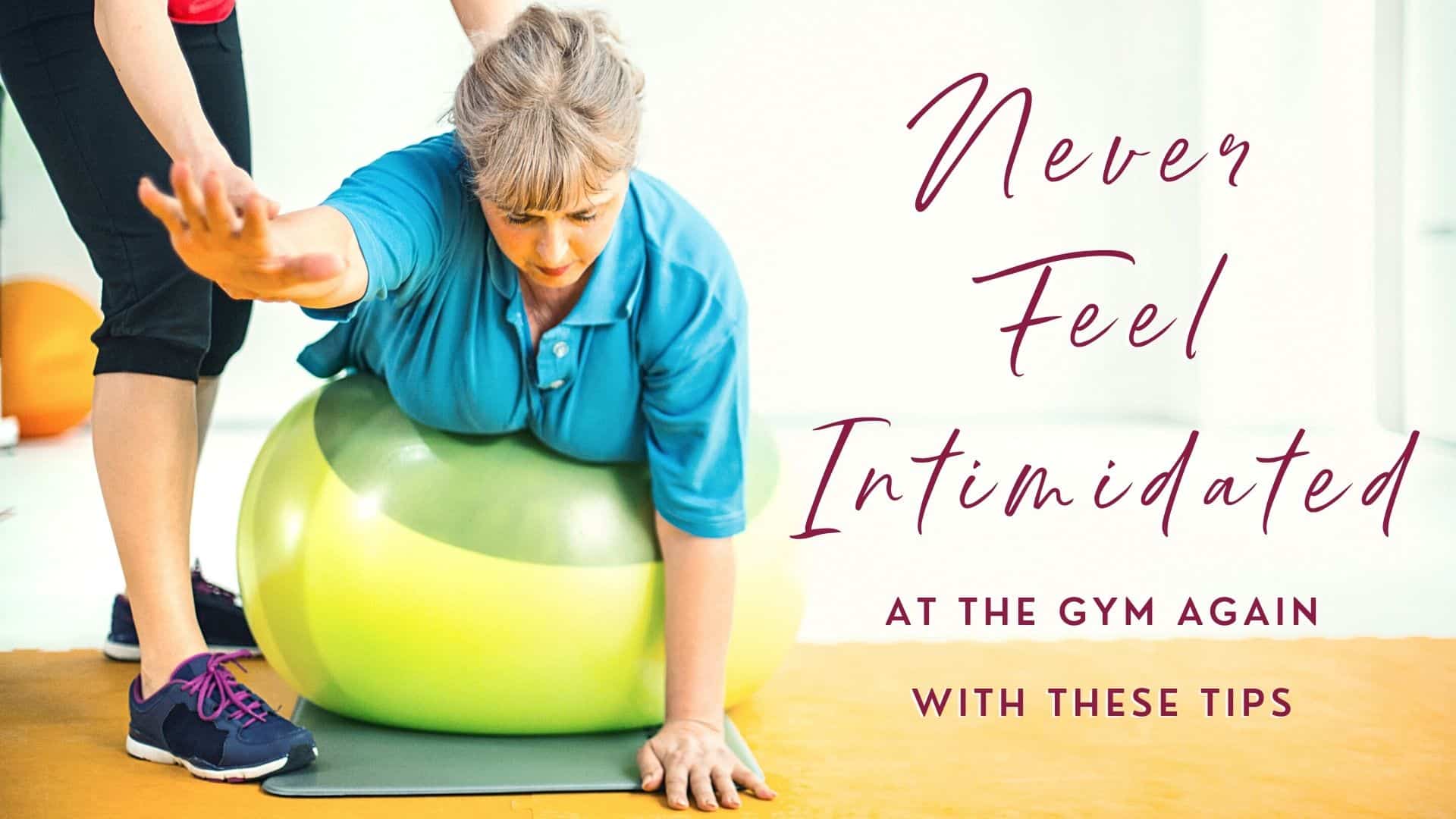 Senior woman exercising in a gym leaning over green Pilates ball with the help of gym instructor