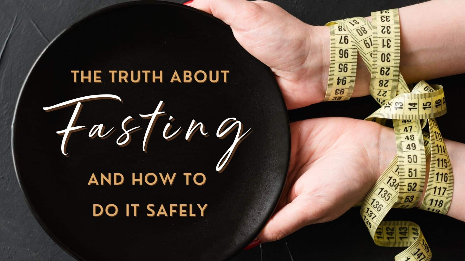 rigid diet fasting weightloss hands tied with measuring tape holding a black empty plate