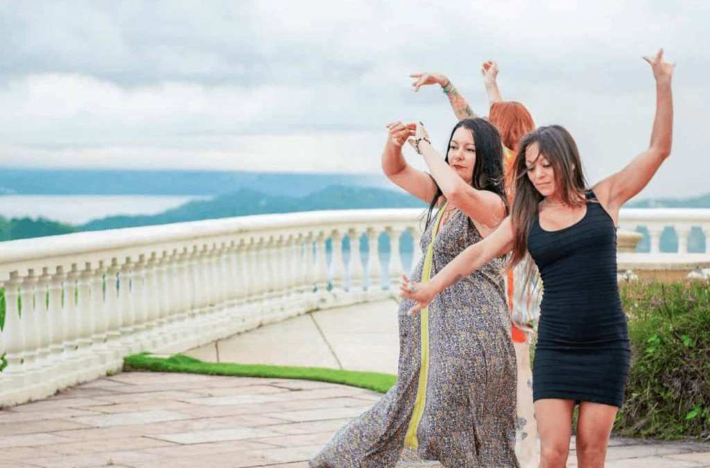 Women dancing on terrace